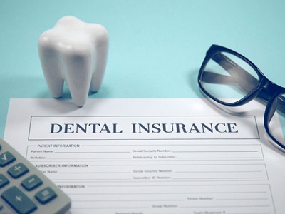 Dental insurance form, molar, and glasses