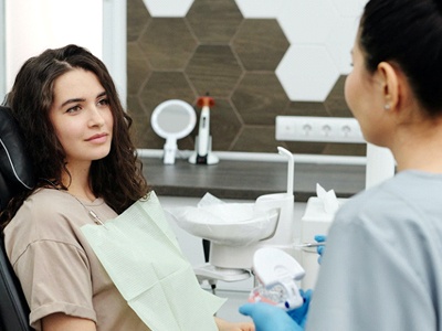 Woman speaking with dental hygienist