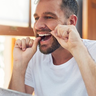 SureSmile patient in Pembroke Pines smiling at dentist after checkup