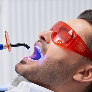 Man receiving dental bonding treatment