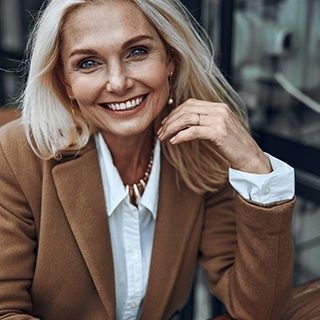 Woman smiling after cosmetic dentistry in Pembroke Pines