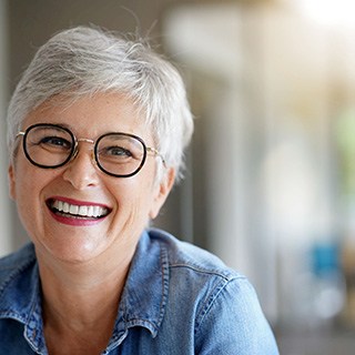 Woman smiling with dentures in Pembroke Pines