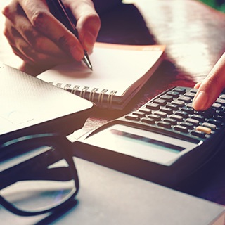 Woman using calculator