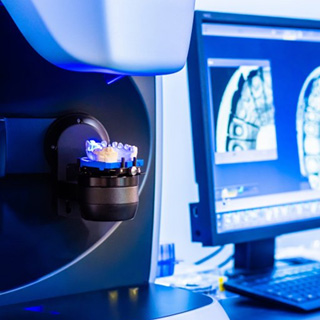 Digital dentures being printed in a dental lab