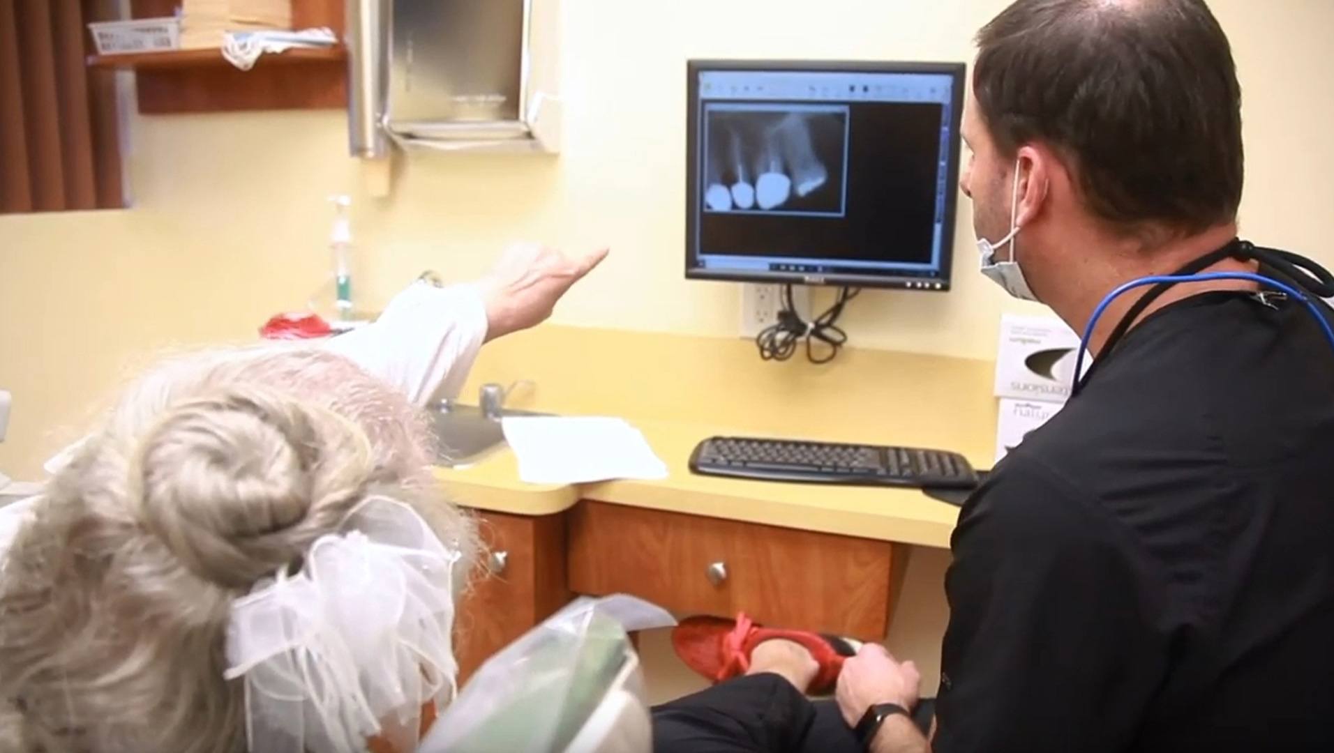 Pembroke Pines dentist talking with a dental patient