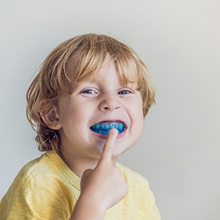 Child wearing a mouthguard