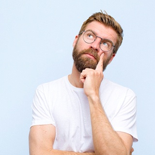 man wondering why dental implants fail