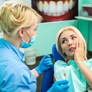 patient who is experiencing the symptoms of dental implant failure