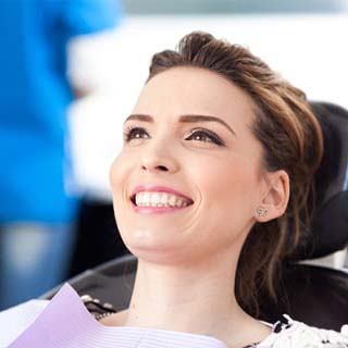 woman at a checkup with her implant dentist in Pembroke Pines