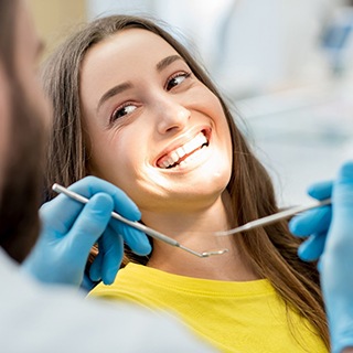 Patient smiling at their implant dentist in Pembroke Pines
