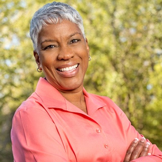 smiling woman standing outdoors