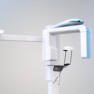 A white C B C T scanner in a dental office