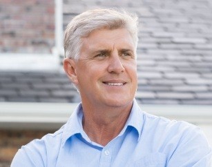 Smiling older man outdoors