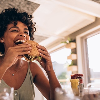 Patient in Pembroke Pines eating after removing their SureSmile aligners