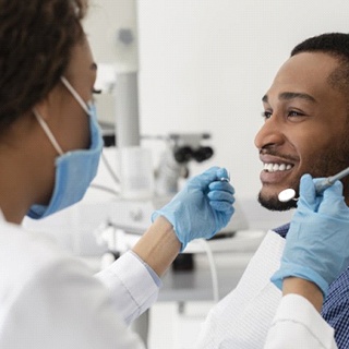 dentist treating young male patient