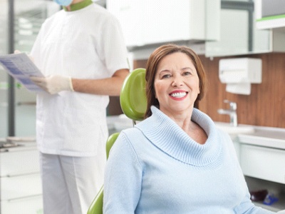 Woman in dental chair smiling