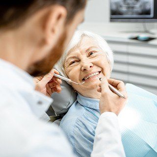 Smiling older woman in dental chair