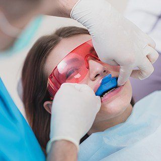 Woman receiving fluoride treatment