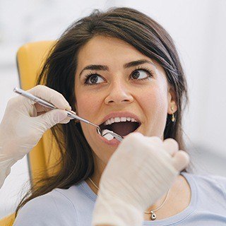 Woman receiving root canal therapy