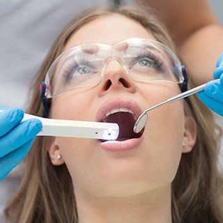 Dentist capturing intraoral images of a patients teeth
