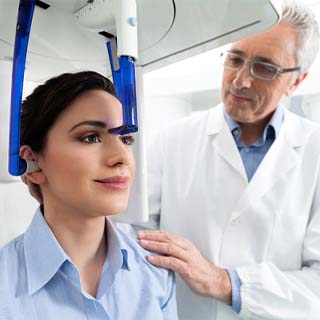 Dental patient getting a cone beam C T scan of their mouth