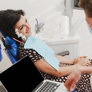 Woman receiving TMJ screening