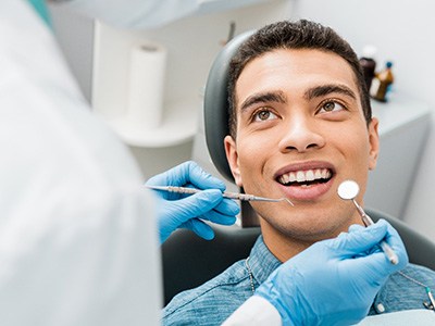 Man smiling after meeting United Healthcare dentist in Pembroke Pines