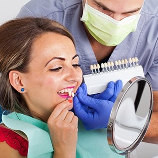 woman in red shirt trying on veneers in Pembroke Pines