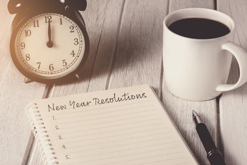 writing New Year’s resolution in journal