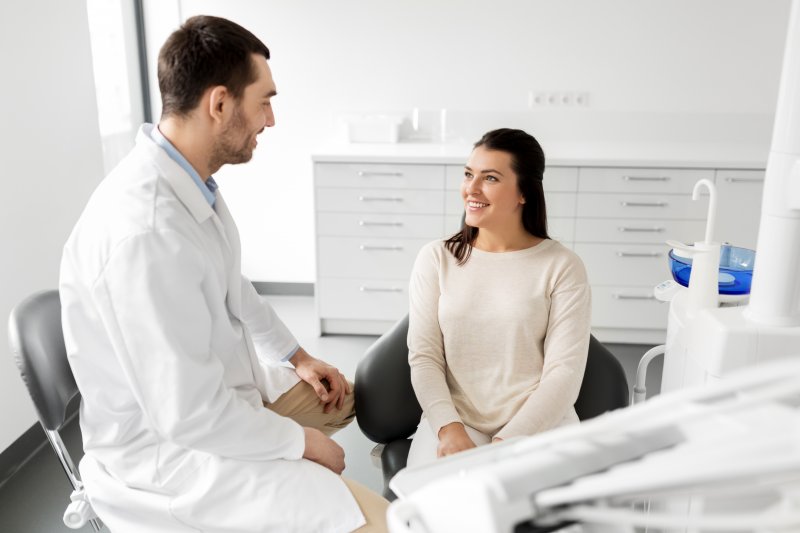 person learning about dental financing at cosmetic dentist office