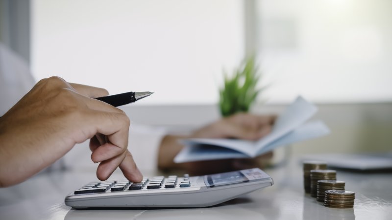 Man using calculator